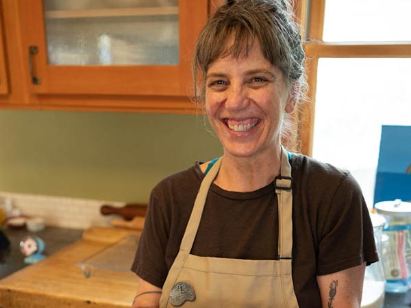Woman holding a tray of brownies